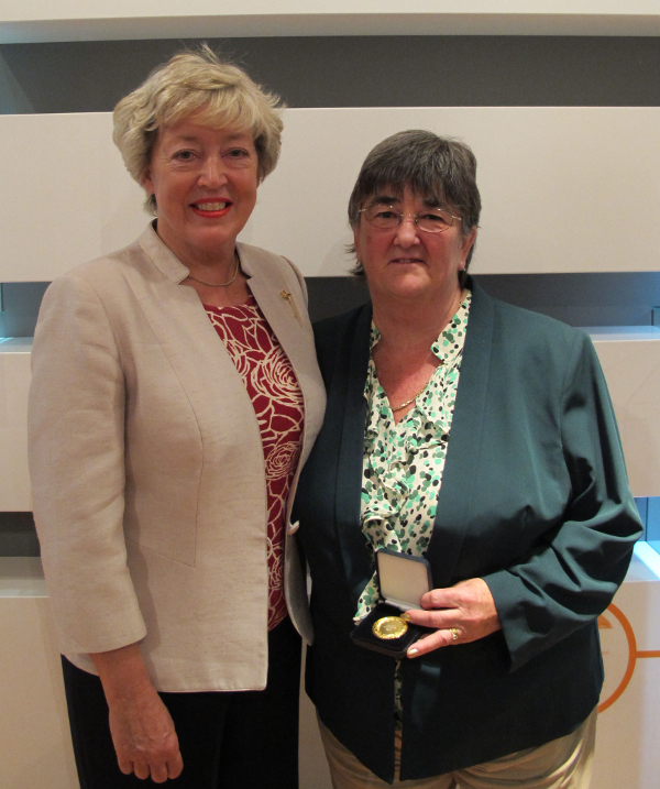 Janet Huggins presented with gold