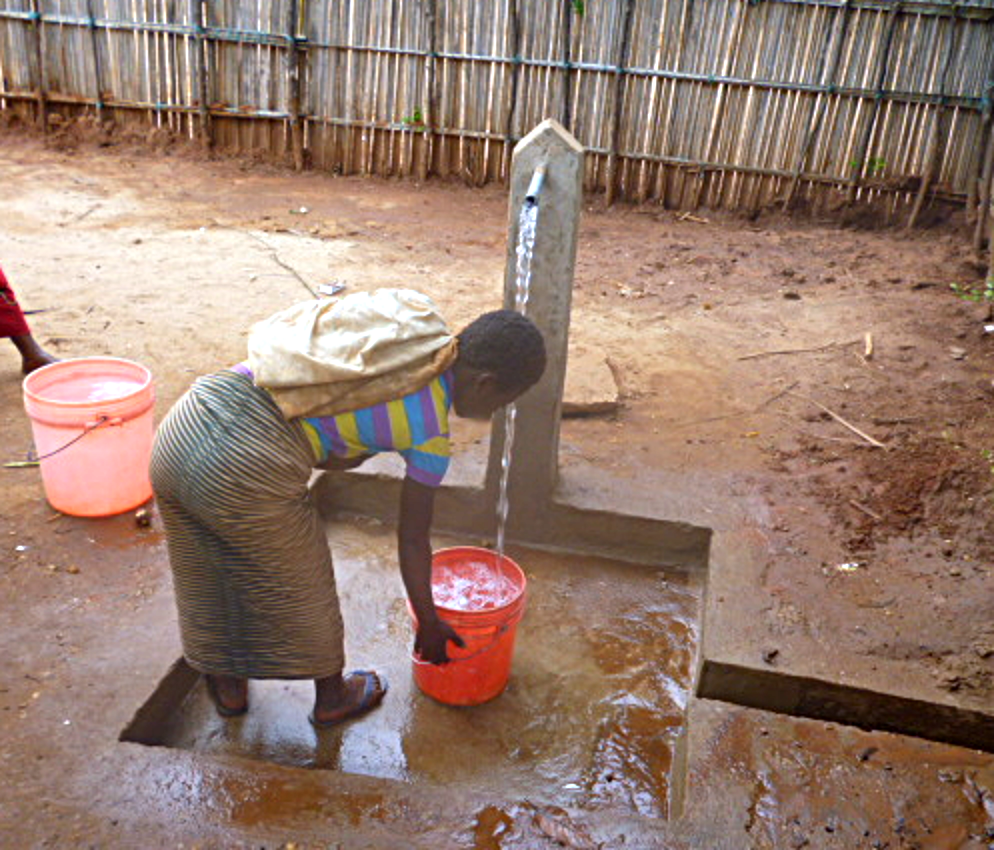 Standpipe in use in village