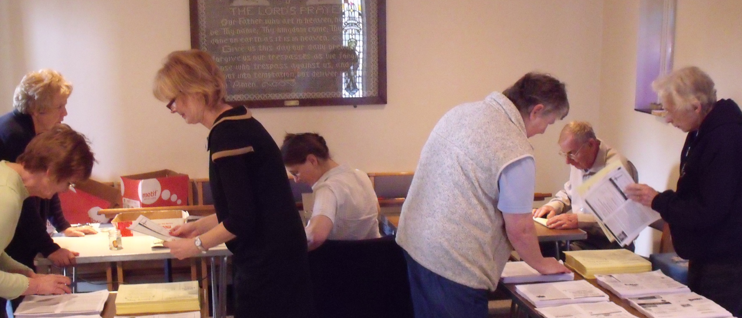 Picture of the team collating the magazine