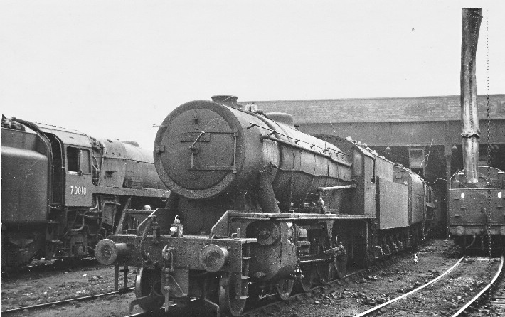 ... Austerity 2-8-0 stands at the shed awaiting its next turn of duty